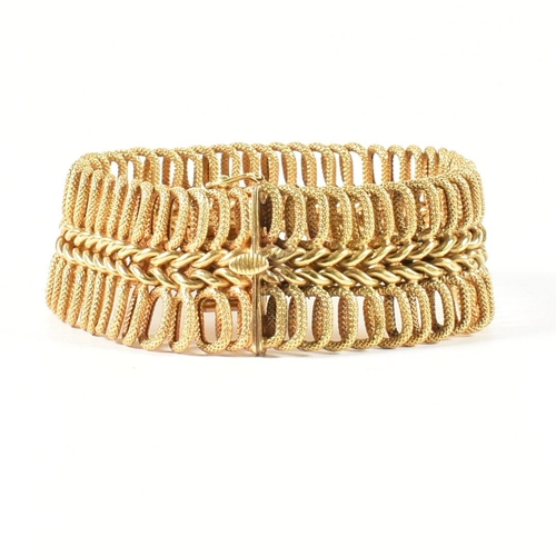 85 - A hallmarked Italian 18ct gold woven link bracelet. The 18ct gold bracelet having a central woven ch... 