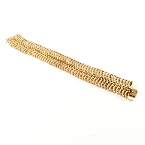 85 - A hallmarked Italian 18ct gold woven link bracelet. The 18ct gold bracelet having a central woven ch... 