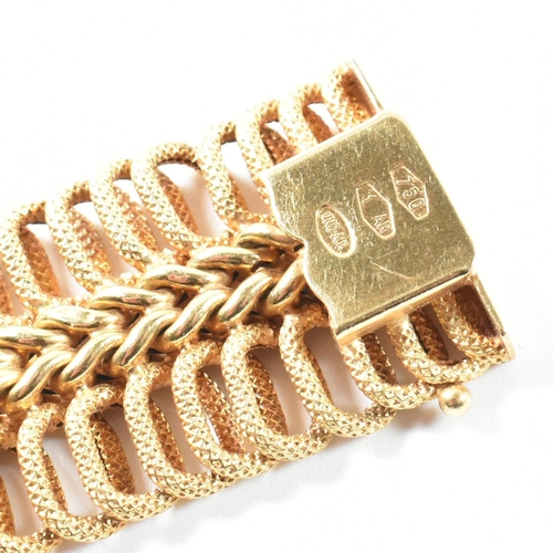 85 - A hallmarked Italian 18ct gold woven link bracelet. The 18ct gold bracelet having a central woven ch... 