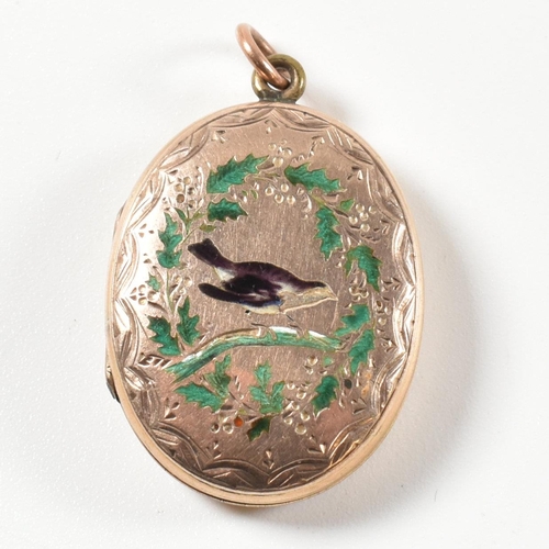 87 - A Victorian locket pendant. The pendant having partial enamel decoration of a robin and holly and pa... 