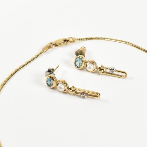 89 - A 14ct gold, topaz, diamond and cultured pearl pendant necklace and earring suite. The 14ct gold nec... 