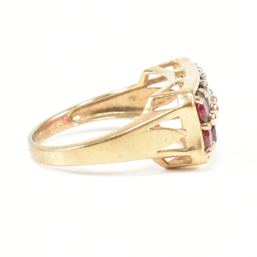 90 - A hallmarked 9ct gold and garnet ring. The ring set with two rows of five oval cut garnets in a rect... 