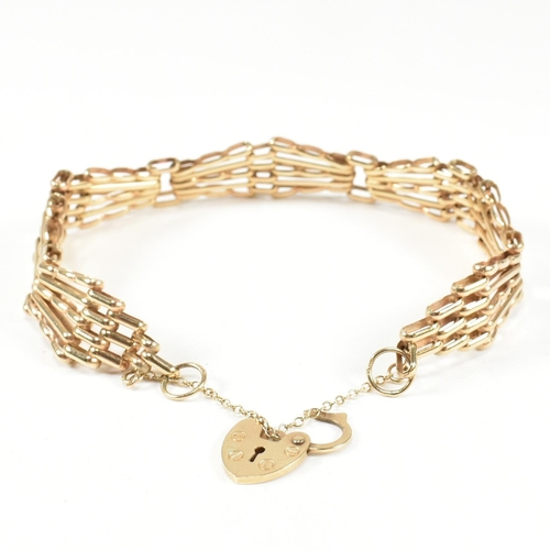 92 - A hallmarked 9ct gold gate link bracelet with heart padlock clasp. The 9ct gold gate link having a h... 