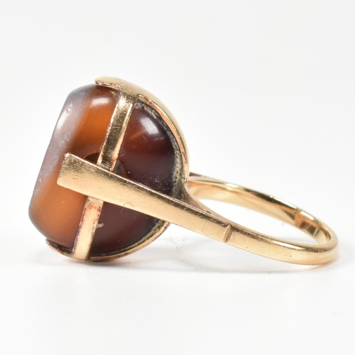 94 - A 14ct gold and carved agate intaglio seal ring. The ring having a carved intaglio bead mounted on i... 