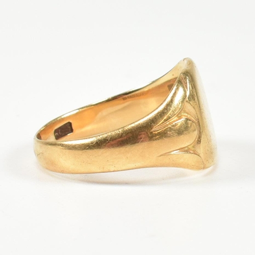 99 - A hallmarked 18ct gold signet ring. The gold signet ring having a shield shape head with vacant cart... 