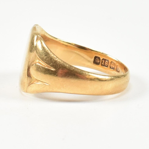 99 - A hallmarked 18ct gold signet ring. The gold signet ring having a shield shape head with vacant cart... 