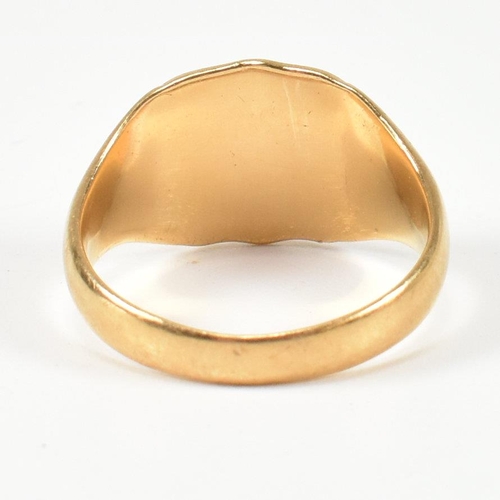 99 - A hallmarked 18ct gold signet ring. The gold signet ring having a shield shape head with vacant cart... 