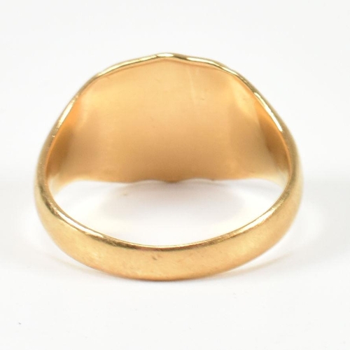 99 - A hallmarked 18ct gold signet ring. The gold signet ring having a shield shape head with vacant cart... 