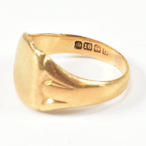 99 - A hallmarked 18ct gold signet ring. The gold signet ring having a shield shape head with vacant cart... 