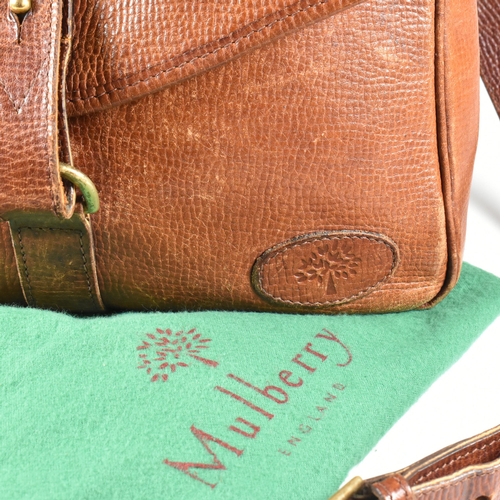 330 - A Mulberry oak leather cartridge crossbody bag. The bag having an oak coloured grain leather exterio... 