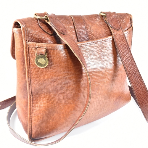 330 - A Mulberry oak leather cartridge crossbody bag. The bag having an oak coloured grain leather exterio... 