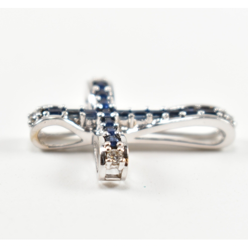 30A - A hallmarked18ct gold sapphire and diamond cross necklace pendant together with a star lapis lazuli ... 