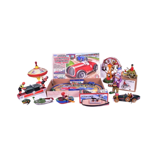 114 - Tinplate Toys - a collection of assorted tinplate clockwork mechanical toys to include a boxed Schyl... 