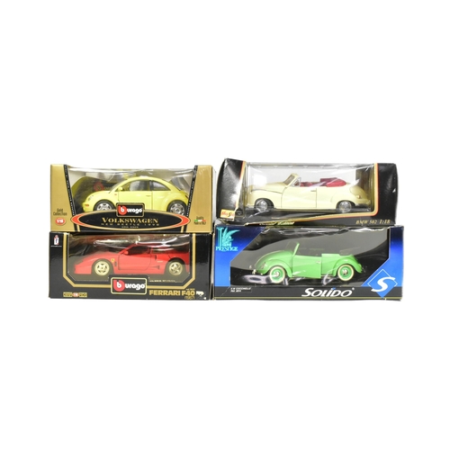 396 - Diecast - a collection of x4 boxed 1/18 scale diecast model cars comprising; Burago Volkswagen Beetl... 