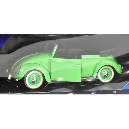 396 - Diecast - a collection of x4 boxed 1/18 scale diecast model cars comprising; Burago Volkswagen Beetl... 