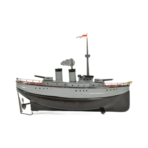 50 - Tinplate Toys - an original vintage German Fleischmann made tinplate clockwork model of a war ship. ... 