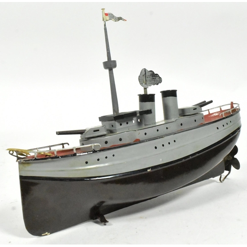 50 - Tinplate Toys - an original vintage German Fleischmann made tinplate clockwork model of a war ship. ... 