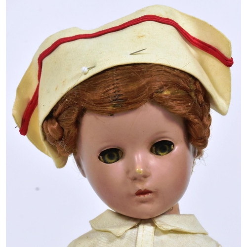 54 - Doll - a c1930s American made 'Madam Alexander' Wendy-Ann 'Nurse' doll. Composition head and body, w... 