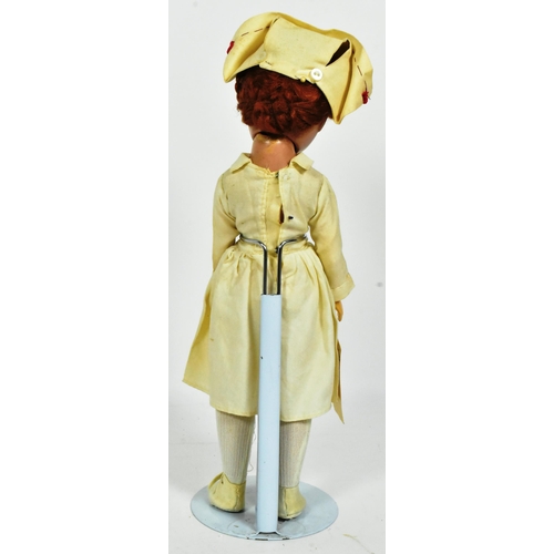 54 - Doll - a c1930s American made 'Madam Alexander' Wendy-Ann 'Nurse' doll. Composition head and body, w... 