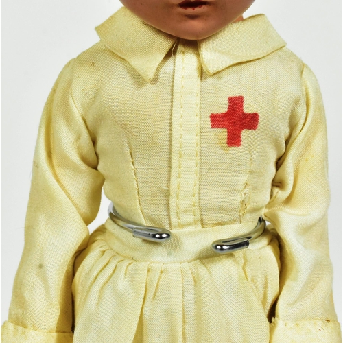 54 - Doll - a c1930s American made 'Madam Alexander' Wendy-Ann 'Nurse' doll. Composition head and body, w... 