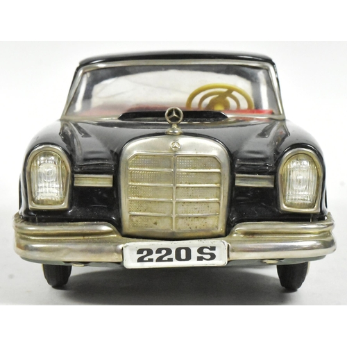 60 - Tinplate Toys - an original vintage Japanese SSS tinplate friction motor Mercedes Benz 220S with a m... 