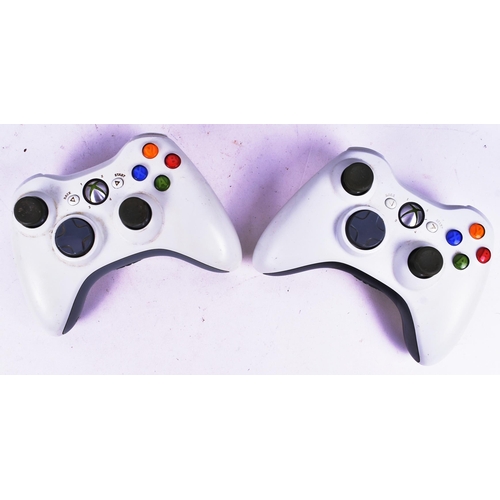 447 - Gaming - Two Microsoft Xbox video gaming consoles comprising the original Xbox and Xbox 360 along wi... 