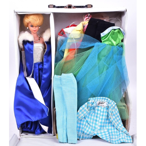 450 - Barbie - an original vintage c1960s Mattel made Barbie doll, with collection of outfits and accessor... 