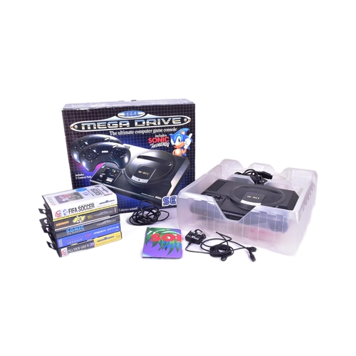 468 - Gaming - an original vintage Sega made 16-Bit Mega Drive games console with controllers, power suppl... 