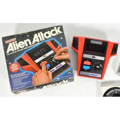 471 - Retro Gaming - a collection of vintage tabletop and hand held video game consoles to include; boxed ... 