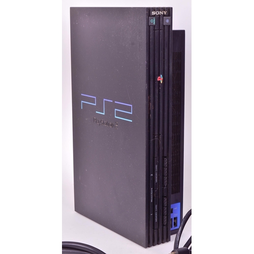 518 - Retro Gaming - an original Sony PS2 Playstation 2 along with a collection of x23 games comprising; R... 