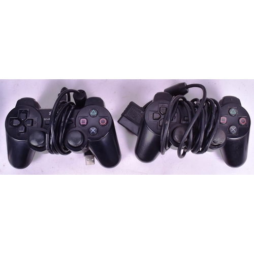 518 - Retro Gaming - an original Sony PS2 Playstation 2 along with a collection of x23 games comprising; R... 