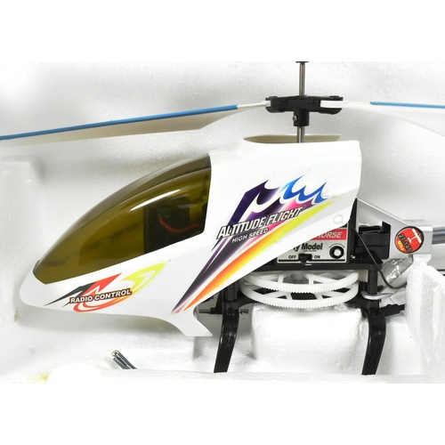 519 - Radio Control - x2 boxed RC Radio Control model helicopters comprising a Syma made 300 Schweizer and... 