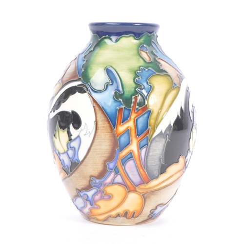 10 - Moorcroft - A china porcelain Moorcroft Pottery rounded vase with tapering top in Badger pattern. De... 