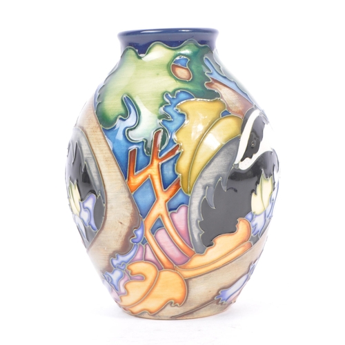 10 - Moorcroft - A china porcelain Moorcroft Pottery rounded vase with tapering top in Badger pattern. De... 