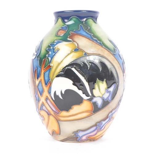 10 - Moorcroft - A china porcelain Moorcroft Pottery rounded vase with tapering top in Badger pattern. De... 