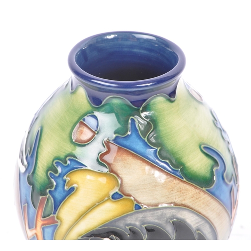 10 - Moorcroft - A china porcelain Moorcroft Pottery rounded vase with tapering top in Badger pattern. De... 