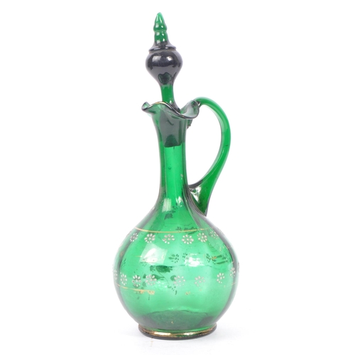 108 - A 19th century bohemian green glass decanter with stopper, with matching handle jug and two drinking... 