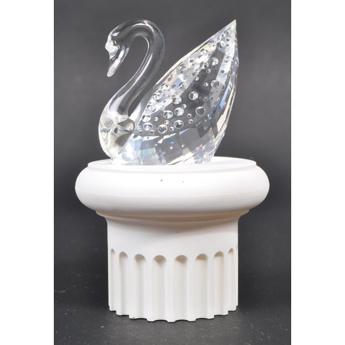 112 - Swarovski - A collection of three boxed Swarovski crystal bird figures. The collection to include a ... 