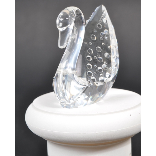 112 - Swarovski - A collection of three boxed Swarovski crystal bird figures. The collection to include a ... 