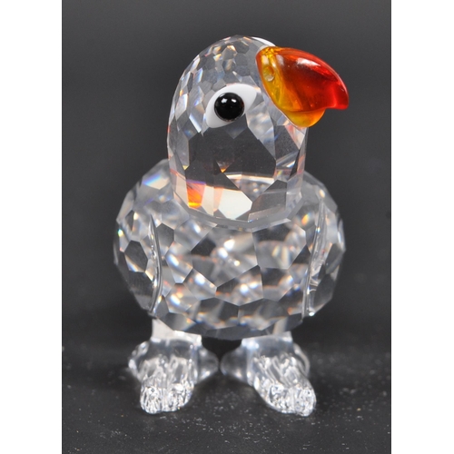 112 - Swarovski - A collection of three boxed Swarovski crystal bird figures. The collection to include a ... 