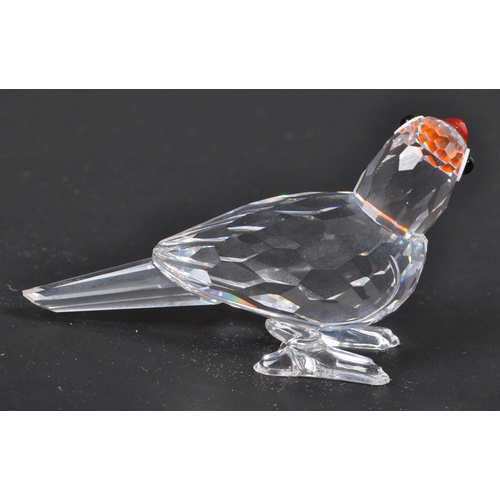 112 - Swarovski - A collection of three boxed Swarovski crystal bird figures. The collection to include a ... 