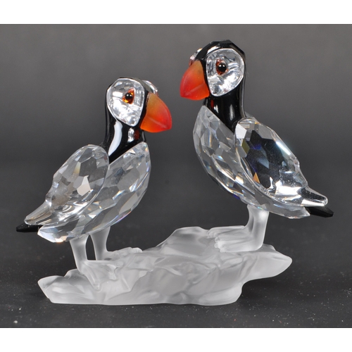 112 - Swarovski - A collection of three boxed Swarovski crystal bird figures. The collection to include a ... 