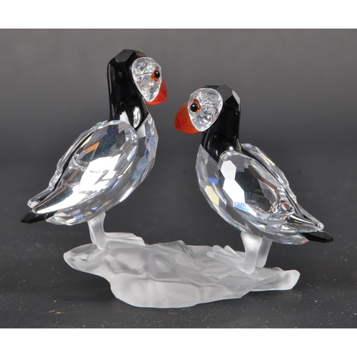 112 - Swarovski - A collection of three boxed Swarovski crystal bird figures. The collection to include a ... 