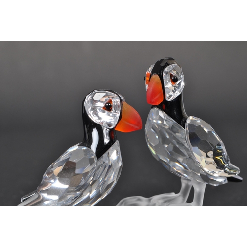 112 - Swarovski - A collection of three boxed Swarovski crystal bird figures. The collection to include a ... 