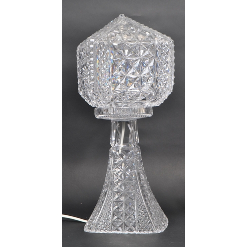 114 - A 20th Century cut glass electric crystal table lamp light comprising of base and shade, the base of... 