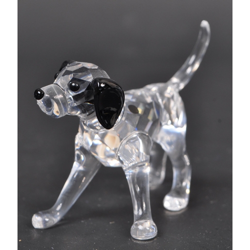 116 - Swarovski - A collection of boxed Swarovski crystal dog figure ornaments. The collection to include ... 