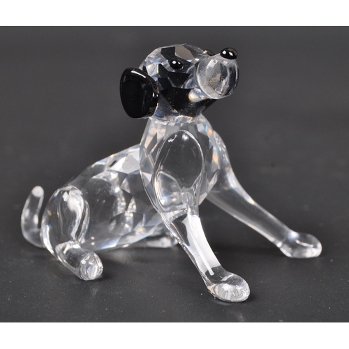 116 - Swarovski - A collection of boxed Swarovski crystal dog figure ornaments. The collection to include ... 