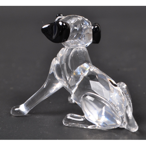 116 - Swarovski - A collection of boxed Swarovski crystal dog figure ornaments. The collection to include ... 