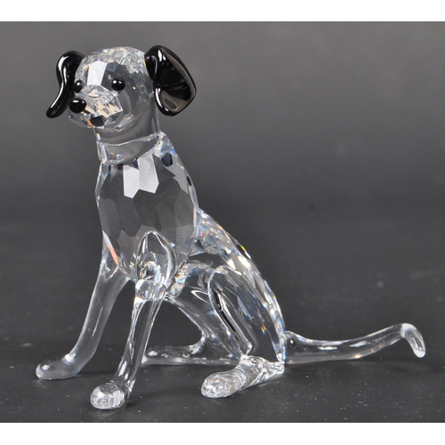 116 - Swarovski - A collection of boxed Swarovski crystal dog figure ornaments. The collection to include ... 