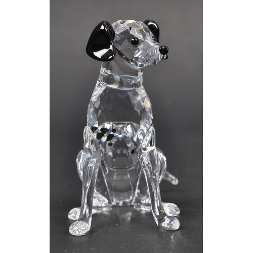 116 - Swarovski - A collection of boxed Swarovski crystal dog figure ornaments. The collection to include ... 